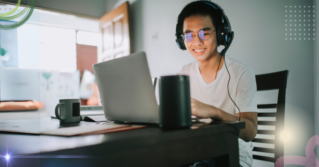 freelance wearing headset while working on his laptop wearing a comfortable white shirt