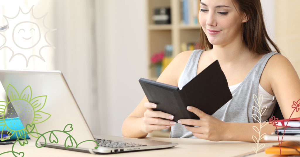 a happy female freelancer holding an eReader